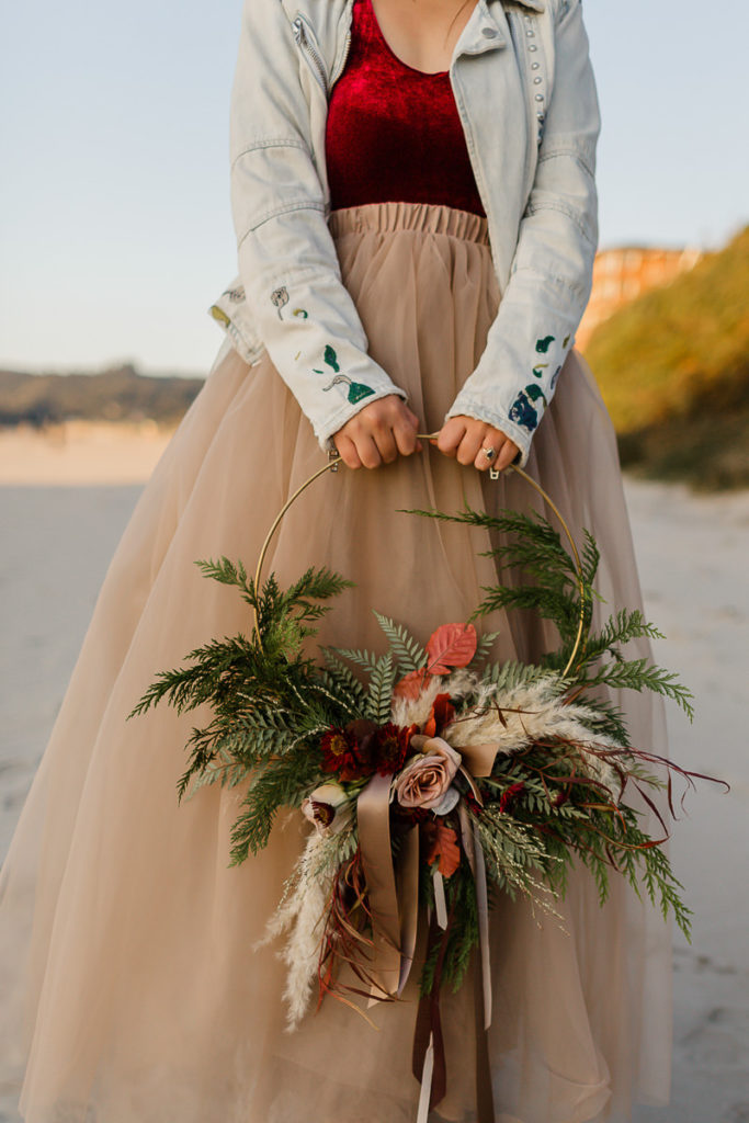 bride holding flower wreath