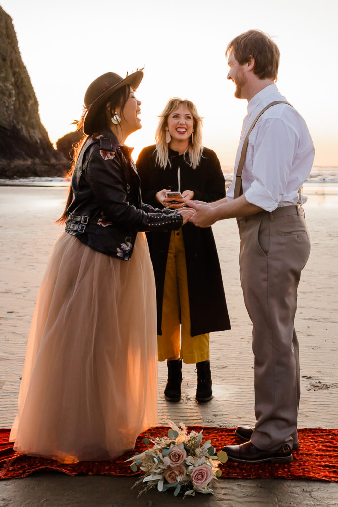 exchanging vows on the sand at cannon beach