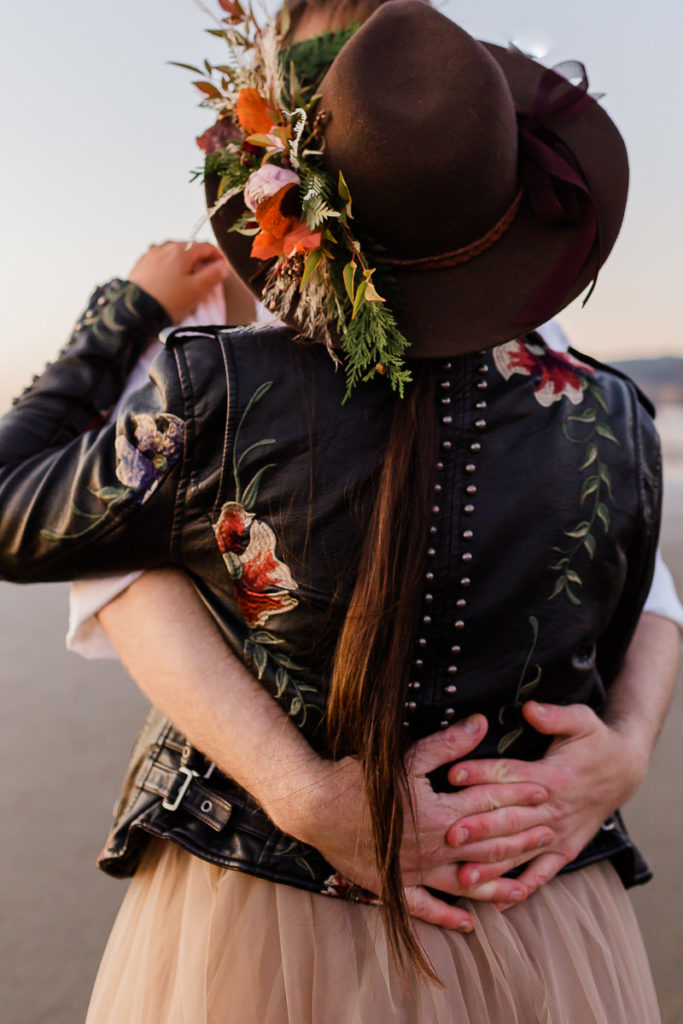 back of brides jacket and floral hat
