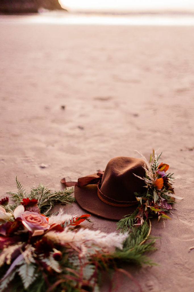 bride floral wreath and hat on the beach