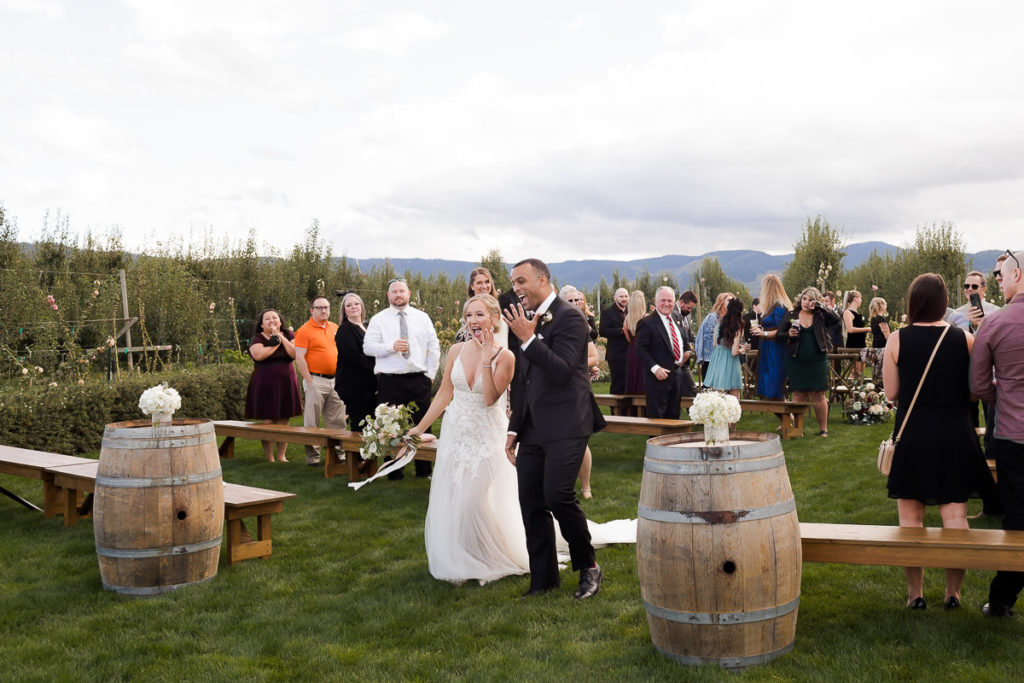 bride and groom celebrating at the orchard in hood river oregon