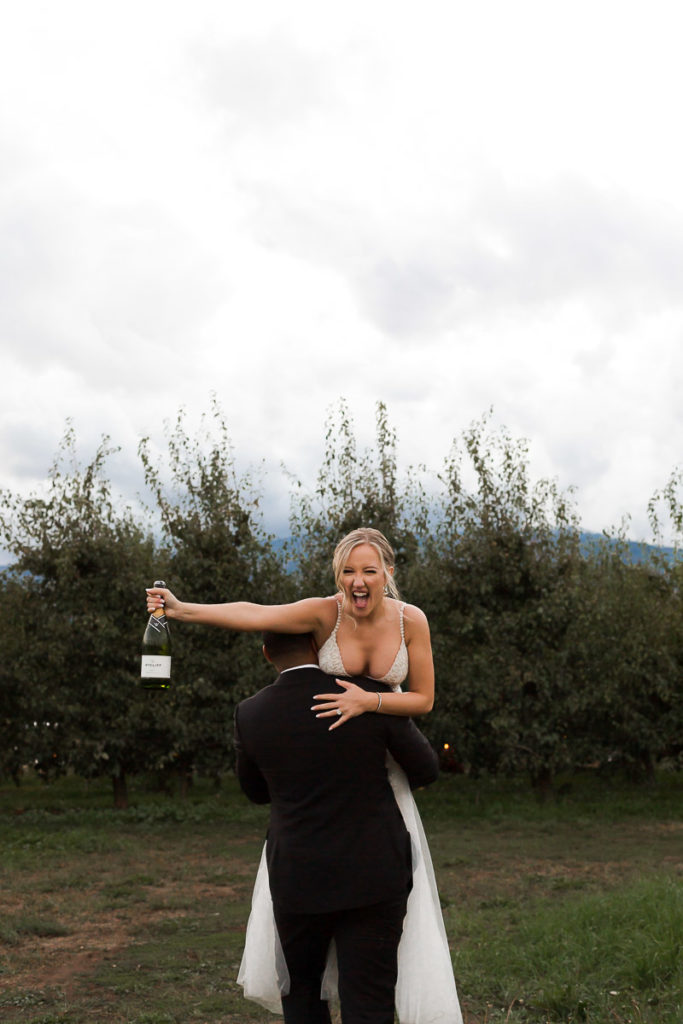 bride celebrating with champagne