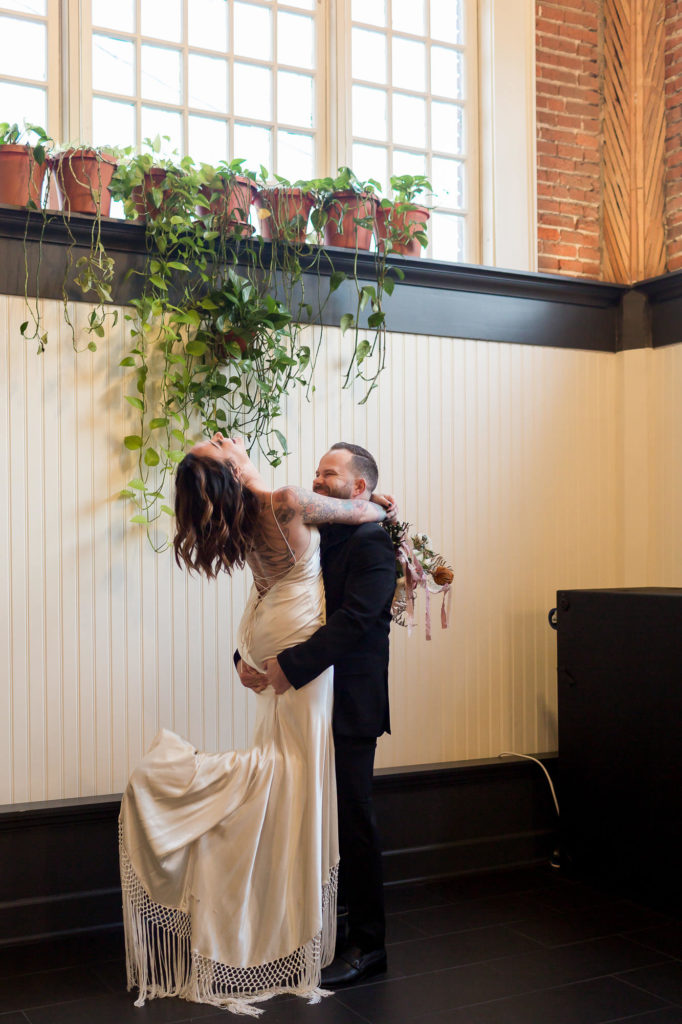 bride and groom sharing a laugh at their evergreen pdx wedding