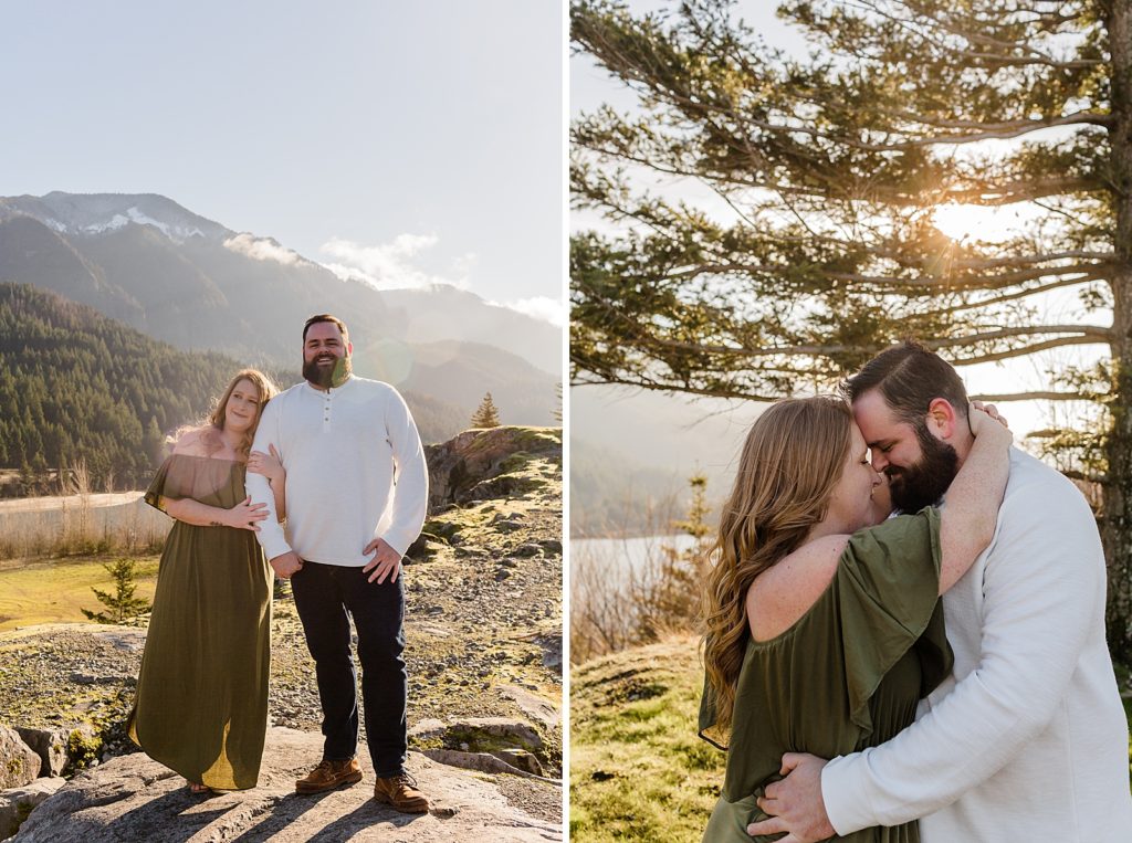 Woman wrapping hands around man's arm and couple nuzzling in front of mountains and tree Government Cove Oregon Engagement Photography captured by Oregon Engagement Photographer Simply Wandering Photography 