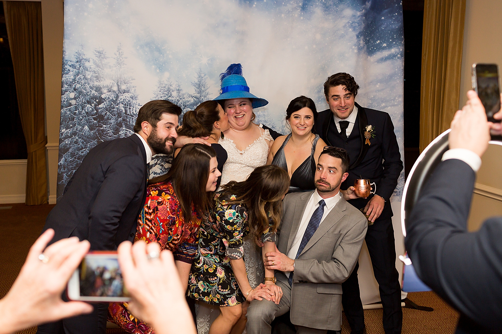Guests taking quirky photobooth picture 