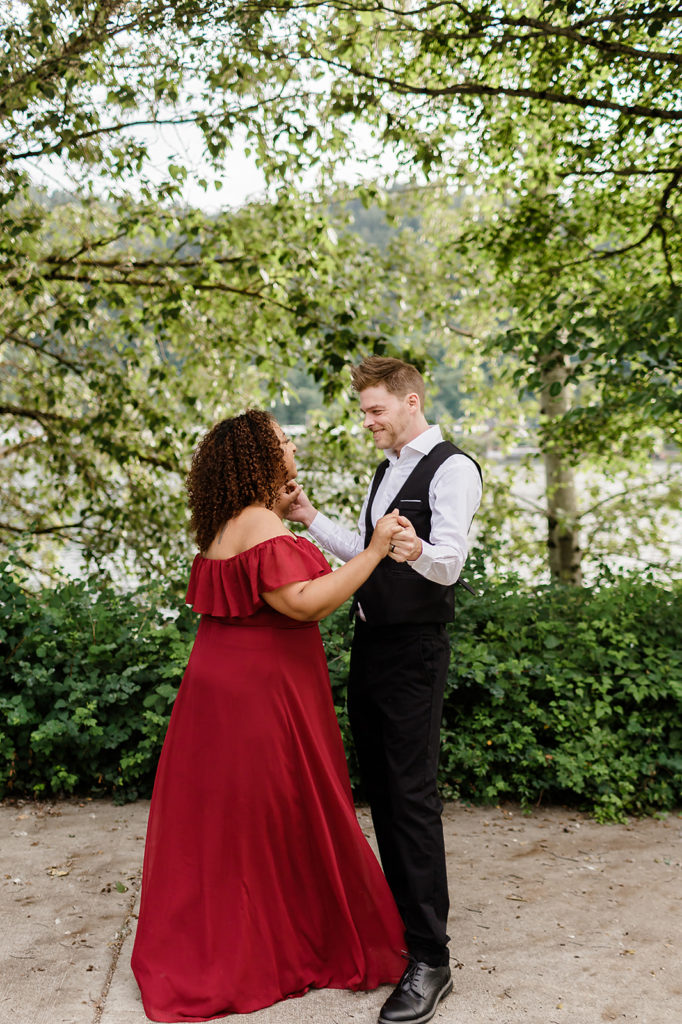 couple dancing together cathedral park engagement photo session