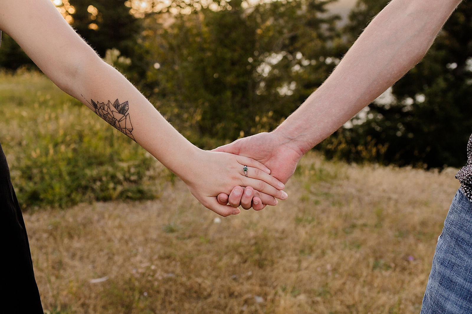 Closeup of couple holding hands