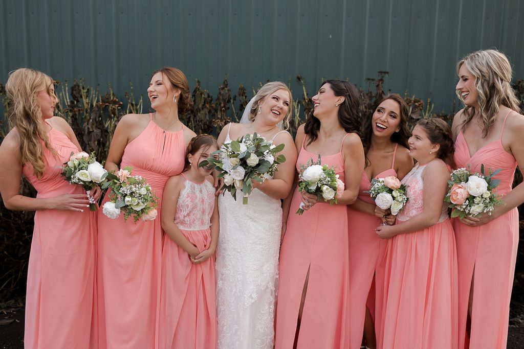 Bride laughing with Bridesmaids