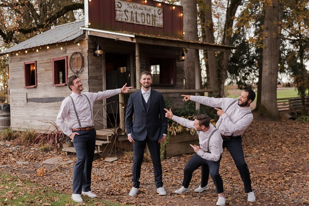 Groom with Groomsmen pointing at him