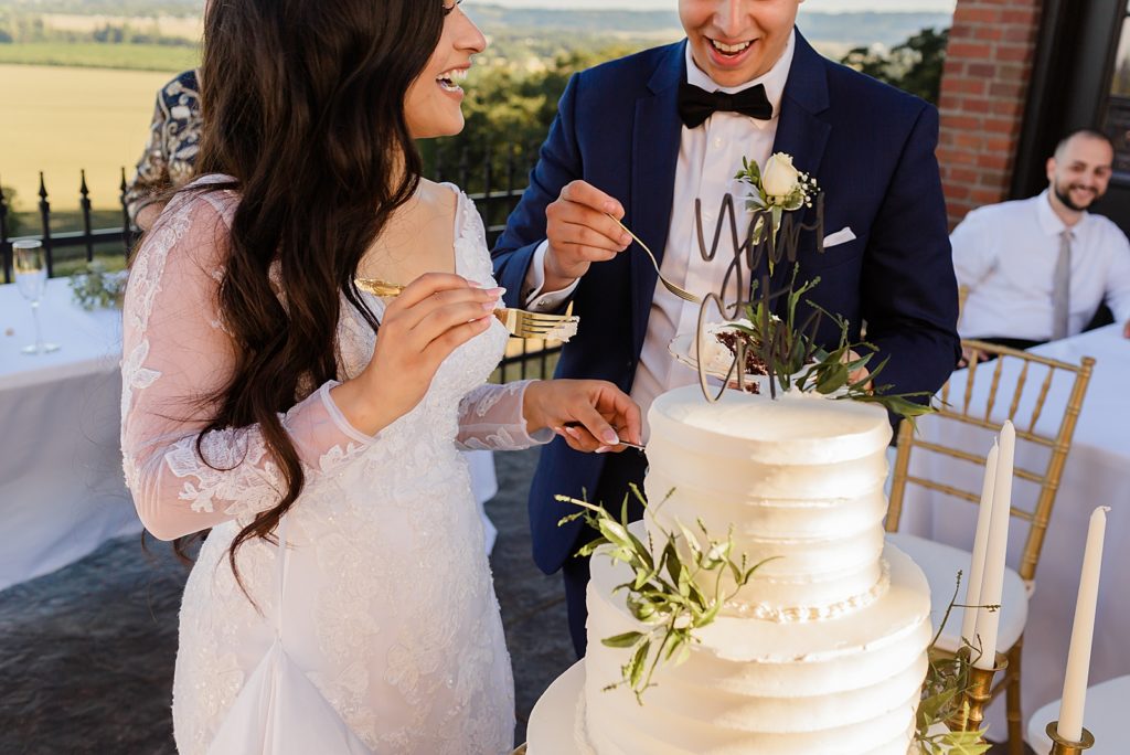 Bride and Groom tasting wedding cake