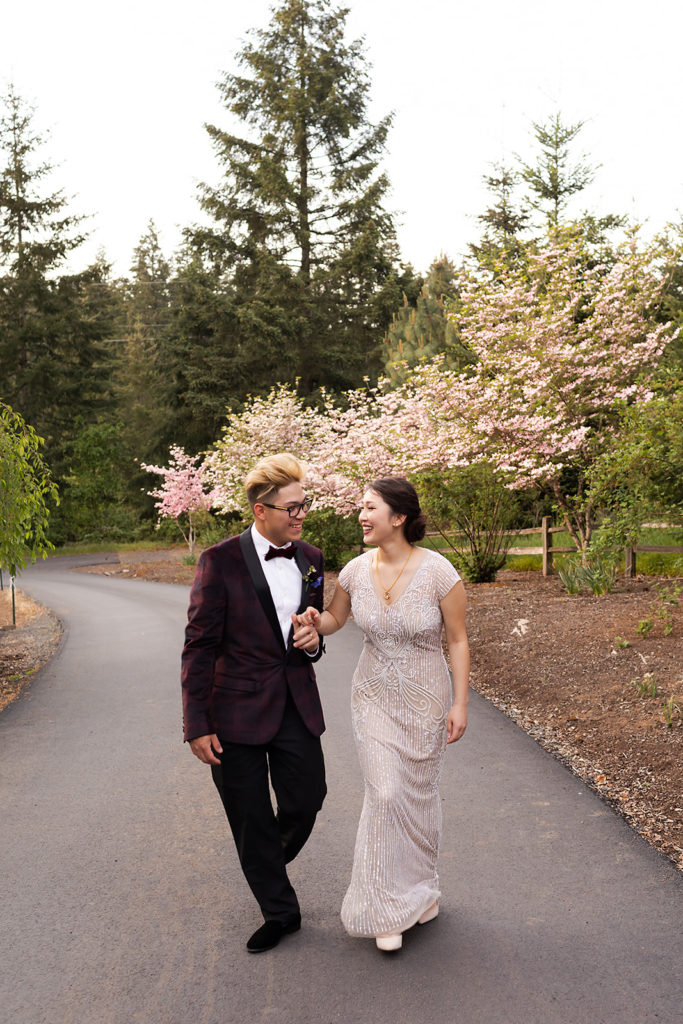 bride and groom walking hand in hand during Romantic Backyard Newberg Wedding Photography